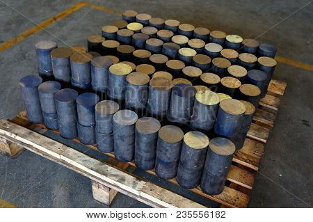 Close Up Of Raw Steel On Pallet  In Indoor Warehouse . Steel On Pallet.