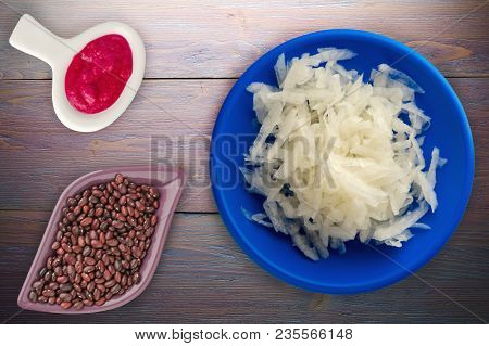 Daikon On A Wooden Background. Daikon On A Plate