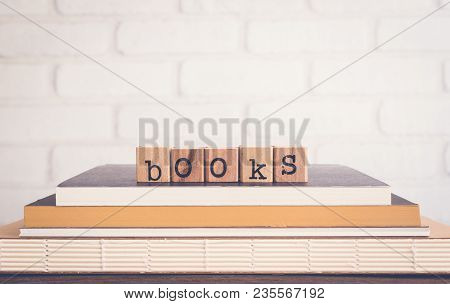 The Word Books, Alphabet On Wooden Cubes On Top Of Books. Background Copy Space, Vintage Minimal Sty