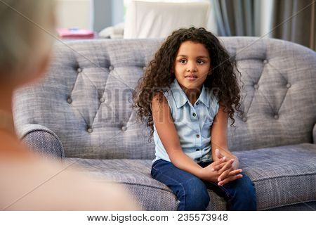 Young girl having therapy with a child psychologist