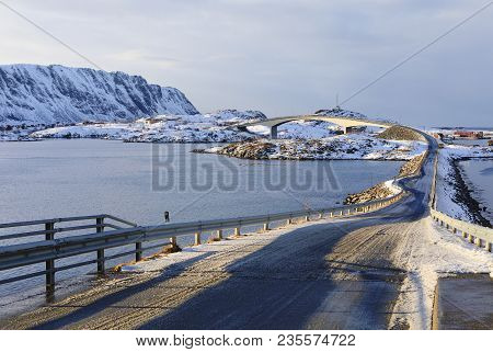 Panoramic View Of Famous Fredvang Bridges In Winter Sunny Evening With Mountains Covered With Snow I