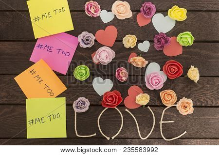 Top View Of Me Too Message Written In Colorful Stickers On A Love Knoted Background.
