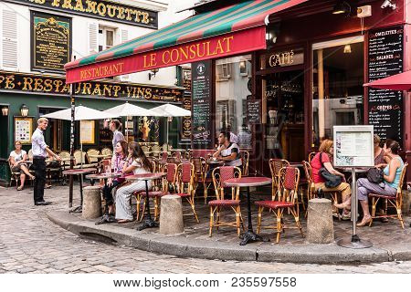 Paris, France - July 06, 2017: The Charming Restaurant Le Consulat On The Montmartre Hill. Parisians