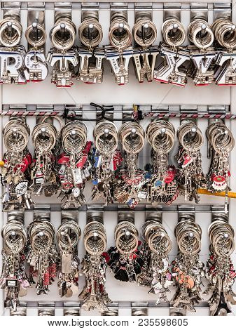 Paris, France - July 06, 2017: Various Colorful Souvenir Keychains With The Symbols Of Paris Are Lai