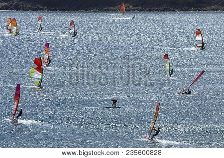 Windsurfers Rides On The Brilliant Waves Of The Beautiful Mediterranean Sea On Cape Prasonisi (rhode