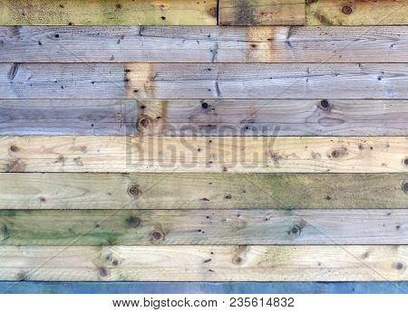 Colorful Old Rustic Wooden Plank Wall Or Floor With Some Of The Boards Stained Blue Made Of Patched 