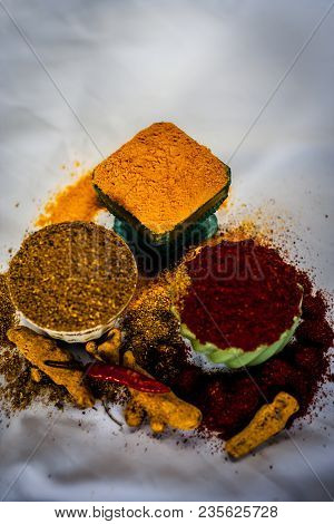 Close Up Of Three Basic Spices Of Indian Asian Food That Are Red Pepper Powder, Turmeric Powder And 