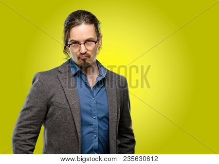 Handsome young man making funny face fooling