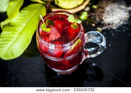 Close Up Of Popular Indian Shrabat Of Guava With Sugar And Masala In A Glass With Raw Fresh Guava On