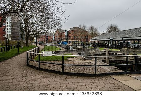 The Curved And Paved Towpath Looking Out Over The Locks And Dry Dock