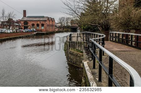 The White Topped Handrail Along The Towpath On The Canal
