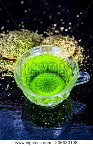 Closes Up Of Essential Tea Of Raw Fresh Fennel Seeds With Raw Fennel Seeds In A Transparent Cup On W