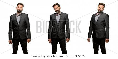 Middle age man, with beard and bow tie with sleepy expression, being overworked and tired