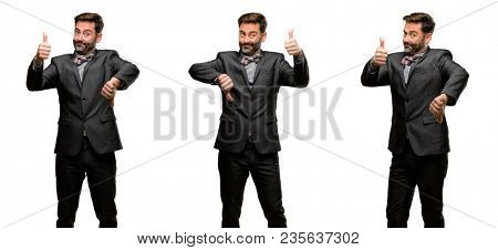 Middle age man, with beard and bow tie confused with thumbs up and down, trying to take a decision expressing doubt and frustration