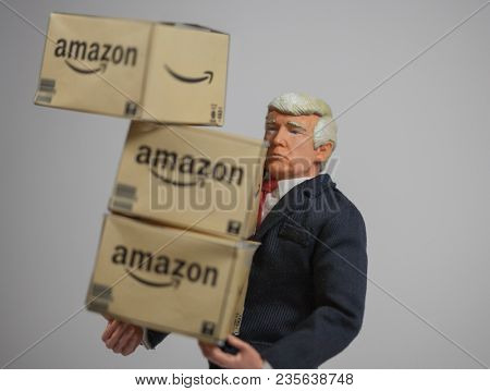 APR 9 2018: Caricature of US President Donald Trump with Amazon delivery boxes. Trump started a billionaire's war on Twitter against Amazon founder Jeff Bezos claiming Amazon is bad for US business