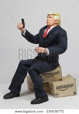 APR 9 2018: Caricature of US President Donald Trump with Amazon delivery boxes. Trump started a billionaire's war on Twitter against Amazon founder Jeff Bezos claiming Amazon is bad for US business