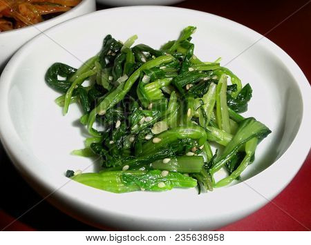 Fried Green Vegetables With Garlic
A Dish Of Fried Green Vegetables Like Chinese Cabbage And Garlic 
