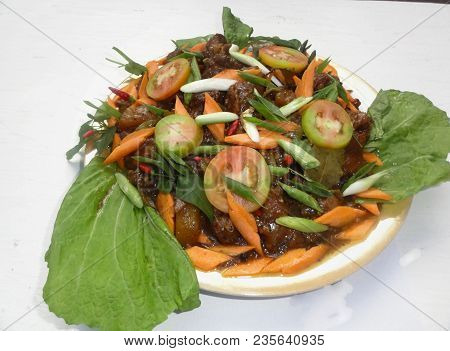 Chamorro Dish Of Chicken Topped With Tomatoes, Carrots, Red Hot Peppers And Green Onions