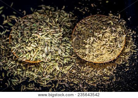 Close Up Of Raw Dried Fennel Seeds Or Variyali Or Foeniculum Vulgare On A Wooden Surface With Its Po