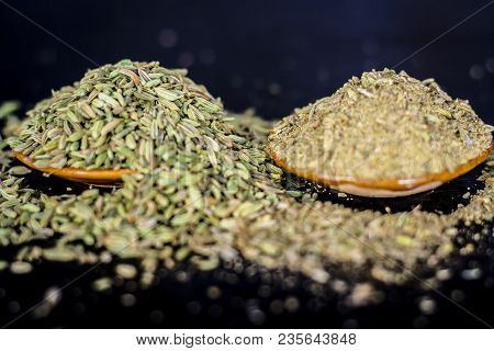 Close Up Of Raw Dried Fennel Seeds Or Variyali Or Foeniculum Vulgare On A Wooden Surface With Its Po