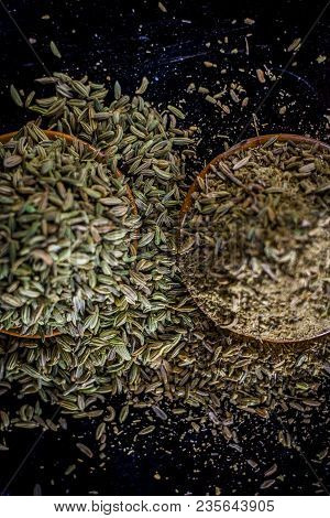 Close Up Of Raw Dried Fennel Seeds Or Variyali Or Foeniculum Vulgare On A Wooden Surface With Its Po