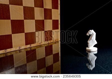 Chess Photographed On A Chessboard And Dark Background
