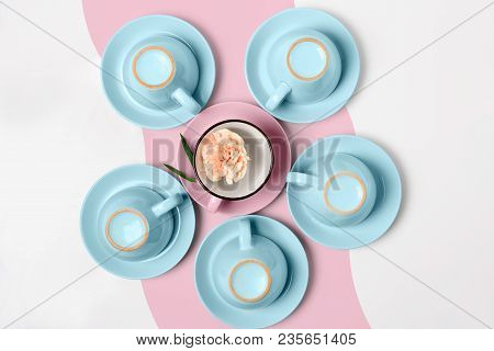 Overturned Coffee Or Tea Set. Plenty Of Elegant Porcelain Light Blue And Pastel Pink Cups Bottoms An