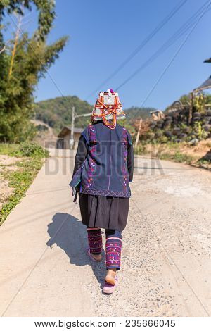 Chiang Rai, Thailand - February 8, 2017: Unidentified Akha woman with traditional clothes and decorated hat in Akha hilltribe village in Northern Thailand