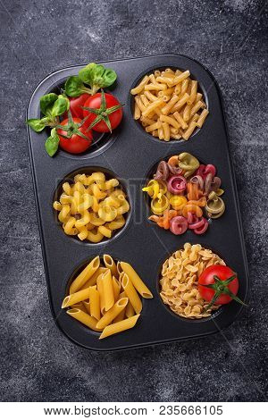Various Type Of Pasta And Cherry Tomato. Top View