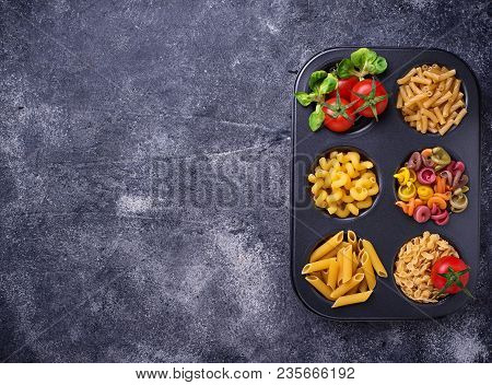 Various Type Of Pasta And Cherry Tomato. Top View