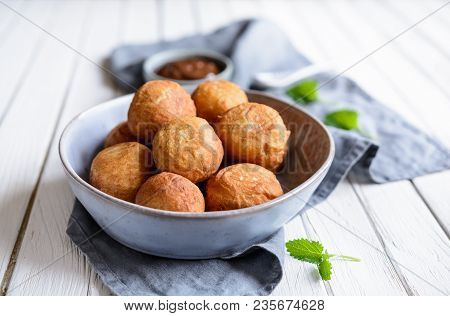 Bunuelos - Traditional Colombian Deep Fried Pastry With Chocolate Sauce