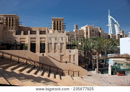 DUBAI, UAE - FEBRUARY, 2018: View on Burj Al Arab, the world only seven stars hotel seen from Madinat Jumeirah, a luxury resort which include hotels and souk spreding across over 40 hectars.