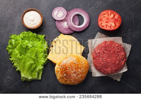 Hamburger Building Kit. Fresh Ingredients For Burger On Dark Stone Table. Top View.