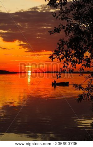 Sunset At Tobol River With A Lone Sailor