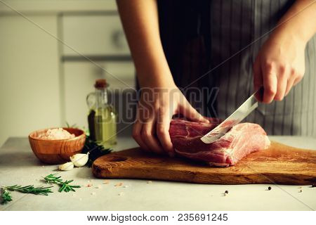Wooman Hands Cutting Beef Meat On Wooden Chopping Board, Rosemary, Oil, Salt, Pepper. Girk Cooking P