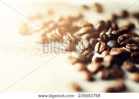 Coffee Beans On Light Wooden Background With Copyspace For Text. Coffee Background, Food Frame, Text
