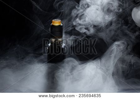 Vape Close-up In A Smoke On A Black Background