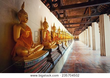 Travel Thailand -  Gloden Buddha Statue In Wat Phutthaisawan On Blue Sky And Cloud Background, Ayutt