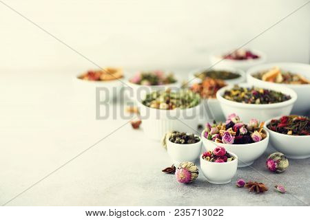 Assortment Of Dry Tea In White Bowls. Tea Types Backgound: Green, Black, Floral, Herbal, Mint, Melis