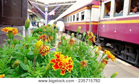 Blurred Railway Station In Kanchanaburi Province,thailand With People On The Bogies And People Walki
