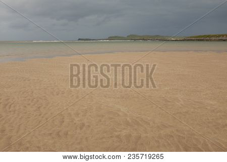 A Beautiful Clean Sandy Beach At The Kyle Of Durness With A View To Faraid Head, Scotland, On The Ho