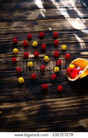Waffle Cone With Berries On A Wooden Background.
