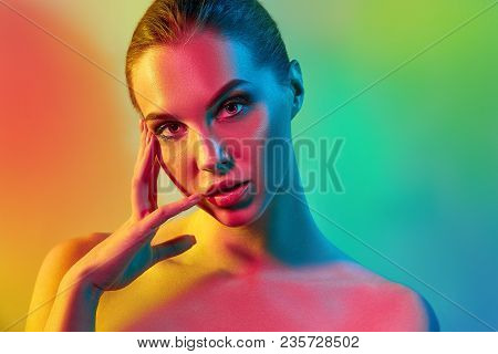 High Fashion Model Woman In Colorful Bright Lights Posing In Studio, Portrait Of Beautiful Sexy Girl