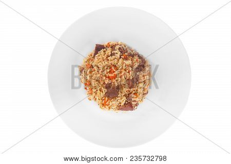 Pilaf, Rice With Meat, Beef, Lamb, With Onion And Carrots, Serving On Plate, Appetizing, Juicy On Wh