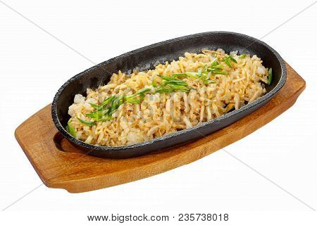 Chahan With Chicken, Pork, With Meat, Green Onions Serving On A Hot Frying Pan, On A Wooden Board On