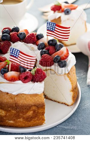 Angel Food Cake With Whipped Cream And Berries For 4th Of July