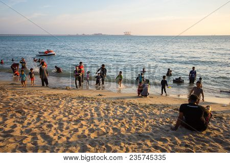 Lumut Perak, Malaysia - March 20, 2018: People Swimming At Beach Of Teluk Batik. Teluk Batik Beach I