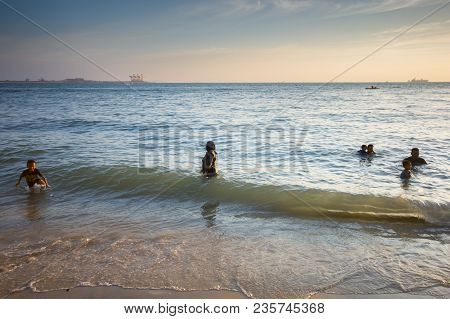 Lumut Perak, Malaysia - March 20, 2018: People Swimming At Beach Of Teluk Batik. Teluk Batik Beach I