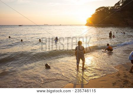 Family Of Three Having Fun On Tropical Beach
