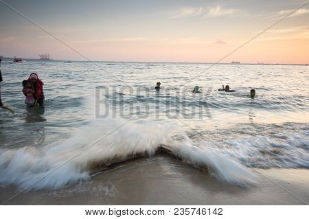 Lumut Perak, Malaysia - March 20, 2018: People Swimming At Beach Of Teluk Batik. Teluk Batik Beach I